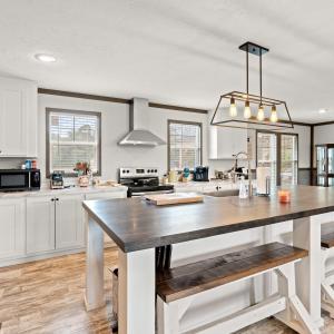 Kitchen with butcher block counters, healthy amoun