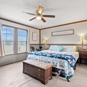 Bedroom featuring a textured ceiling, light colore