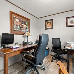 Office area featuring ornamental molding, wood fin