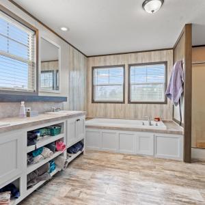 Full bathroom featuring a shower stall, a bath, do