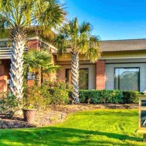 View of front of home featuring brick siding and a
