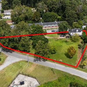 Aerial view of property and surrounding area with