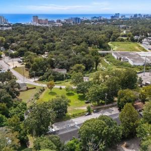 View of urban area featuring a tree filled landsca