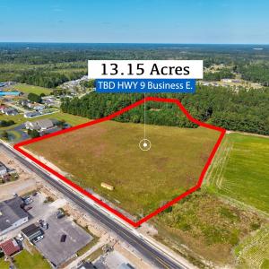 Aerial view of property and surrounding area with