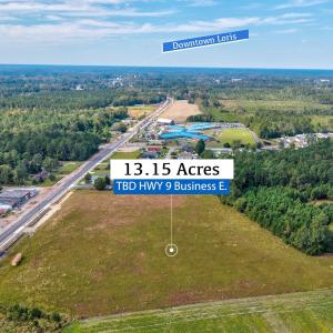 View of property location with a heavily wooded ar