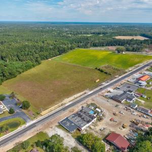 View of property location with a heavily wooded ar