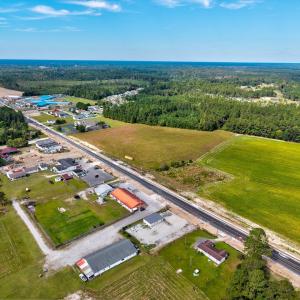Aerial view of property and surrounding area featu