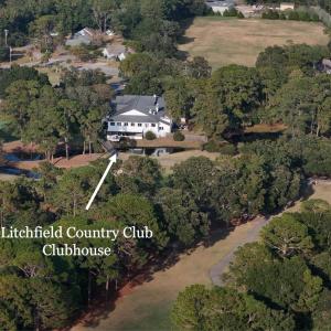 Aerial view of property and surrounding area with