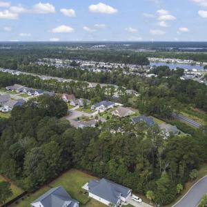 Aerial view of property and surrounding area with