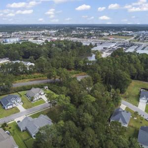 Aerial view of property and surrounding area with