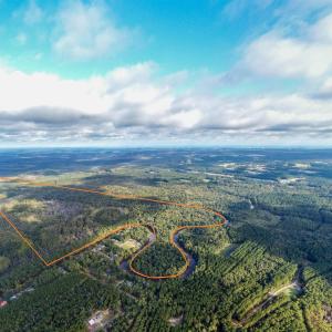 Aerial view of property and surrounding area featu