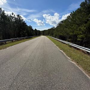 Paved Portion of Hidden River Road going over the