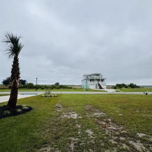 View of community featuring a yard and stairway
