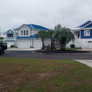 View of grassy yard with street views
