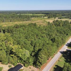 Aerial view of property and surrounding area with