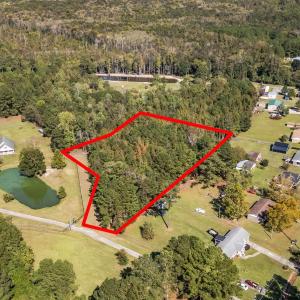 Aerial view of property and surrounding area with