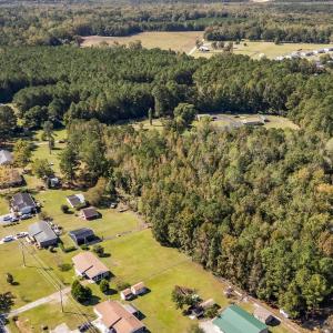 Aerial view of property and surrounding area with