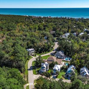 View of property location with a forest and a near