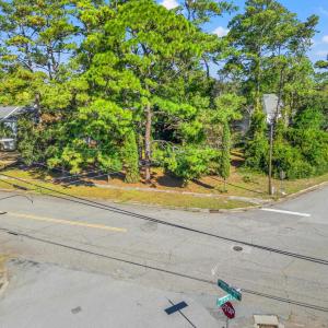 View of asphalt street with curbs and street light