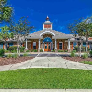 Exercise room featuring light wood-type flooring