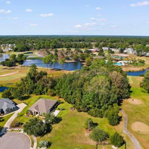 Aerial view of residential area featuring a golf c