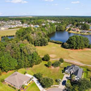 Aerial view of residential area with a nearby body