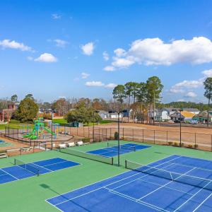 View of tennis court featuring community basketbal