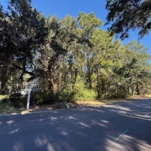 View of asphalt road with a view of trees