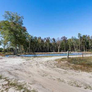 View of dirt / gravel road featuring a water view