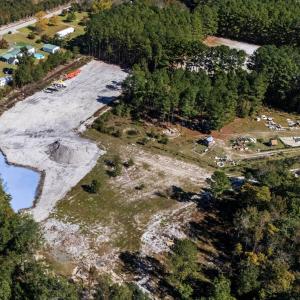 Aerial view of property's location with a large bo