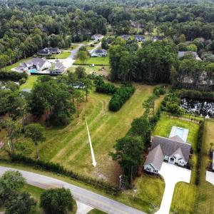 Aerial view of property and surrounding area with