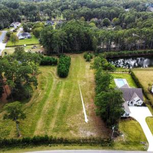 Aerial view of residential area with a large body