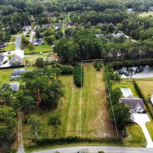 Aerial view of residential area with a large body