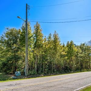 View of asphalt road with street lighting