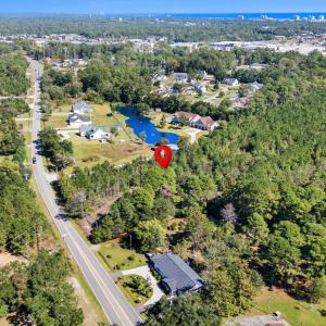 Aerial view of property and surrounding area with