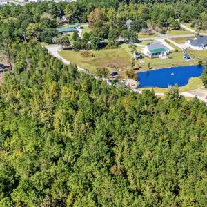 Aerial view of property and surrounding area featu
