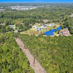 Aerial overview of property's location with a larg