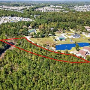 Aerial view of property and surrounding area with