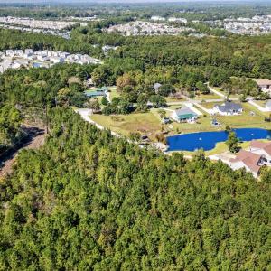 Aerial view of property and surrounding area featu