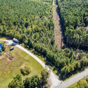 Aerial view of property and surrounding area with