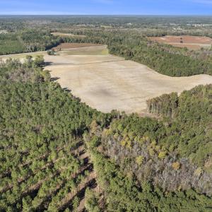 Aerial view of property and surrounding area with