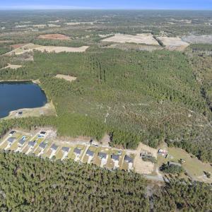 Aerial view of property and surrounding area with
