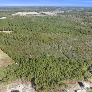 View of property location with a forest and a larg