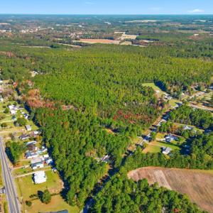View of property location featuring a forest