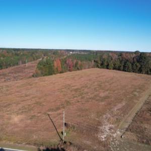 Aerial view of property and surrounding area with