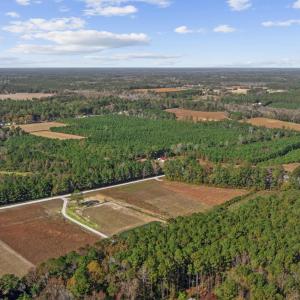 Aerial view of property's location with a forest