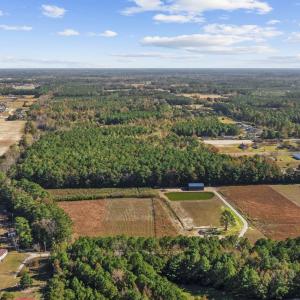 View of property location featuring a forest