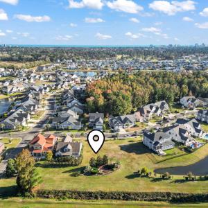 Aerial view of property's location with a nearby b