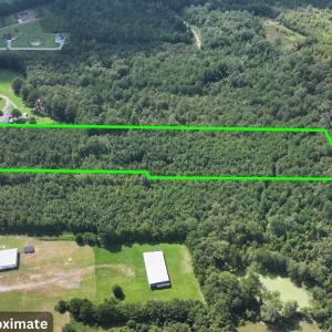 Aerial view of property and surrounding area with