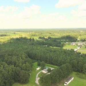 Aerial view of property and surrounding area with